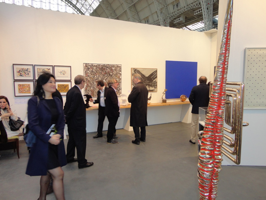 Renowned British contemporary art collector and patron Frank Cohen (center left) in conversation on the stand of London Modern British dealer Austin Desmond at ART14 London’s VIP evening on Feb. 27. Image Auction Central News.  